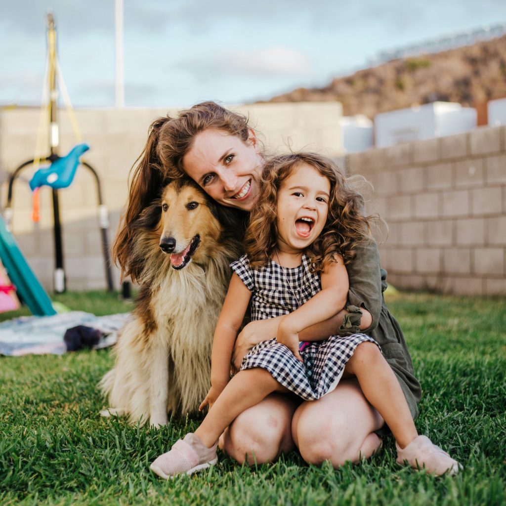 Family with their adopted rescue dog from WAG Rescue in Wimberley, Texas